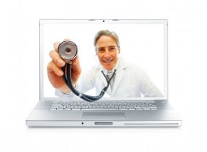 Digital composite - Happy senior doctor holding a stethoscope through a laptop screen